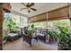 Relaxing screened porch with wicker furniture and lush plants at 2029 Landry Ln, Rock Hill, SC 29732