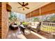 Relaxing screened porch with wicker furniture and brick flooring at 2029 Landry Ln, Rock Hill, SC 29732