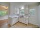 White kitchen with ample cabinetry and tile flooring at 59 Myrtle Sw Ave, Concord, NC 28025