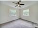 Bright bedroom with ceiling fan and neutral carpeting at 59 Myrtle Sw Ave, Concord, NC 28025