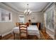 Formal dining room with chandelier, hardwood floors, and window seating at 4006 St. Andrews Ct # 4, Cramerton, NC 28032