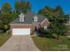 Brick house with a two-car garage and landscaping at 4006 St. Andrews Ct # 4, Cramerton, NC 28032