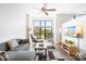 Open concept living room with L-shaped sofa and large windows at 706 N Davidson St, Charlotte, NC 28202