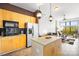 Modern kitchen with island and open living area at 706 N Davidson St, Charlotte, NC 28202