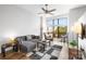 Open concept living room with L-shaped sofa and large windows at 706 N Davidson St, Charlotte, NC 28202