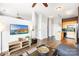 Open living room, hardwood floors, L-shaped sofa, kitchen with island at 706 N Davidson St, Charlotte, NC 28202