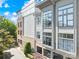 Modern townhome building with brick and siding, featuring multiple units and parking at 706 N Davidson St, Charlotte, NC 28202