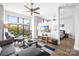 Open concept living room with L-shaped sofa and large windows at 706 N Davidson St, Charlotte, NC 28202