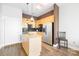 Modern kitchen with light wood cabinets, granite counters, and stainless steel appliances at 706 N Davidson St, Charlotte, NC 28202