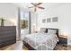 Bright bedroom with large window, dresser, and queen-size bed at 706 N Davidson St, Charlotte, NC 28202