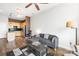 Open concept living room with L-shaped sofa and kitchen view at 706 N Davidson St, Charlotte, NC 28202