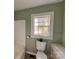Clean bathroom with toilet, tub, and window at 704 Mcadenville Rd, Lowell, NC 28098