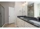 Bathroom with double vanity, granite countertop, and shower at 5318 Cross St, Charlotte, NC 28269