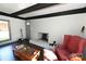 Living room with a wood burning stove, built-in shelving and dark hardwood floors at 1630 Shirley Ln, Newton, NC 28656