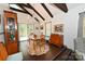 Bright dining area with hardwood floors, chandelier, and access to a deck at 1630 Shirley Ln, Newton, NC 28656