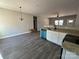 Open dining area with grey vinyl plank flooring at 119 Woodline Dr, Troy, NC 27371