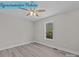 Bright bedroom with wood-look floors and a ceiling fan at 642 Mckee St, Albemarle, NC 28001