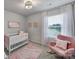 Peaceful Bedroom featuring a crib, rocking chair and plenty of natural light at 210 Audra Faye Ln, Indian Trail, NC 28079