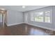 Living room with hardwood floors, an entryway, and windows at 5323 Buena Vista Ave, Charlotte, NC 28205