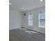 Spacious spare bedroom with hardwood floors and large windows at 5323 Buena Vista Ave, Charlotte, NC 28205