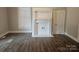 Living room with hardwood floors and fireplace at 508 S Yadkin Ave, Spencer, NC 28159