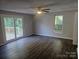 Spacious living room with wood-look floors and sliding glass doors at 508 S Yadkin Ave, Spencer, NC 28159