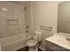 Modern bathroom with marble-tiled shower and vanity at 508 S Yadkin Ave, Spencer, NC 28159