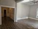 View of a hardwood floor hallway leading to other rooms at 508 S Yadkin Ave, Spencer, NC 28159