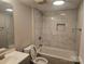 Updated bathroom with a bathtub and marble tile at 508 S Yadkin Ave, Spencer, NC 28159