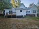 White house with deck and neighboring house at 508 S Yadkin Ave, Spencer, NC 28159