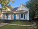 Charming white house with blue doors at 508 S Yadkin Ave, Spencer, NC 28159