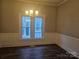 Dining room features hardwood floors and wainscoting at 508 S Yadkin Ave, Spencer, NC 28159