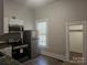 Kitchen with stainless steel appliances and white cabinets at 508 S Yadkin Ave, Spencer, NC 28159