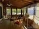 Spacious screened porch with table and chairs at 201 Deer Park Rd, Mount Gilead, NC 27306