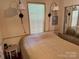 Bright bedroom with a double bed and mirrored closet at 201 Deer Park Rd, Mount Gilead, NC 27306