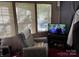 Living room with comfortable seating and large window at 201 Deer Park Rd, Mount Gilead, NC 27306