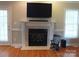 Fireplace with a white mantel and tile surround in the living room at 2318 Joseph Ct, Rock Hill, SC 29732