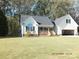 Two-story house with gray roof, attached garage, and a neatly landscaped yard at 2318 Joseph Ct, Rock Hill, SC 29732