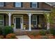 Inviting front porch with brick columns and ample seating at 724 Misty Arbor Frd, Clover, SC 29710