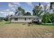 Spacious backyard with deck, fire pit, and garden space at 1123 Golden Maple Ln, Chester, SC 29706