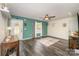 Bright living room with hardwood floors, a ceiling fan, and access to front door at 1123 Golden Maple Ln, Chester, SC 29706
