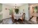 Bright dining room adjacent to kitchen, featuring a floral table setting at 1123 Golden Maple Ln, Chester, SC 29706