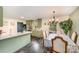 Charming dining area with a table for six and view into the kitchen at 1123 Golden Maple Ln, Chester, SC 29706