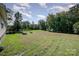 Large backyard with garden boxes and mature trees at 1123 Golden Maple Ln, Chester, SC 29706
