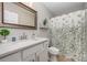 Simple bathroom with single vanity, shower/tub combo, and updated flooring at 1123 Golden Maple Ln, Chester, SC 29706