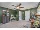 Spacious bedroom with dark green walls, ceiling fan, and built-in shelving at 1123 Golden Maple Ln, Chester, SC 29706
