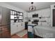 Modern kitchen with stainless steel appliances and white shaker cabinets at 1664 Old Charlotte Rd, Concord, NC 28027