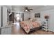 Spacious bedroom with ceiling fan and hardwood floors at 1664 Old Charlotte Rd, Concord, NC 28027