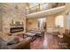 Open living room with stone fireplace and high ceilings at 1140 Fern Hill Rd, Mooresville, NC 28117