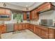 Modern kitchen with wood cabinets and granite countertops at 1140 Fern Hill Rd, Mooresville, NC 28117